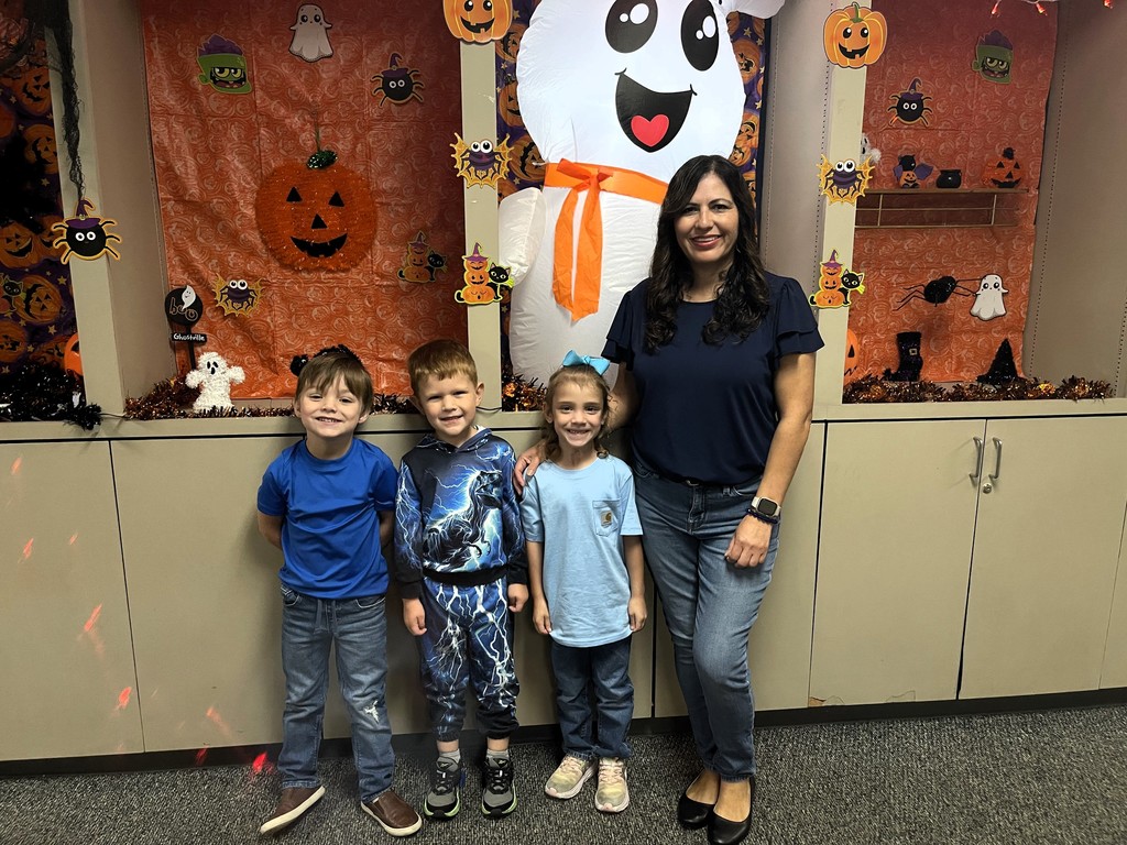 students wearing blue with staff