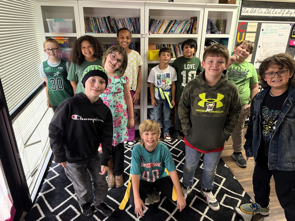 students wearing green and/or athletic gear