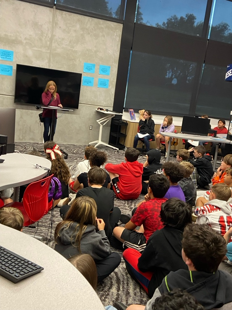 student giving speech to peers