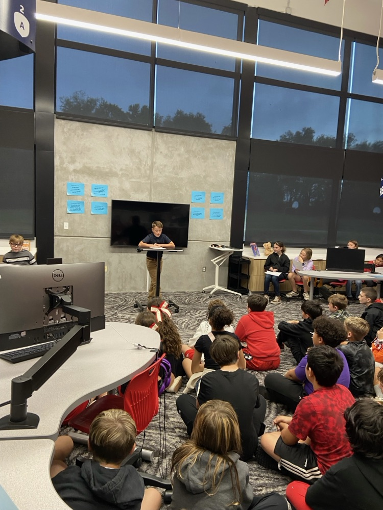 student giving speech to peers