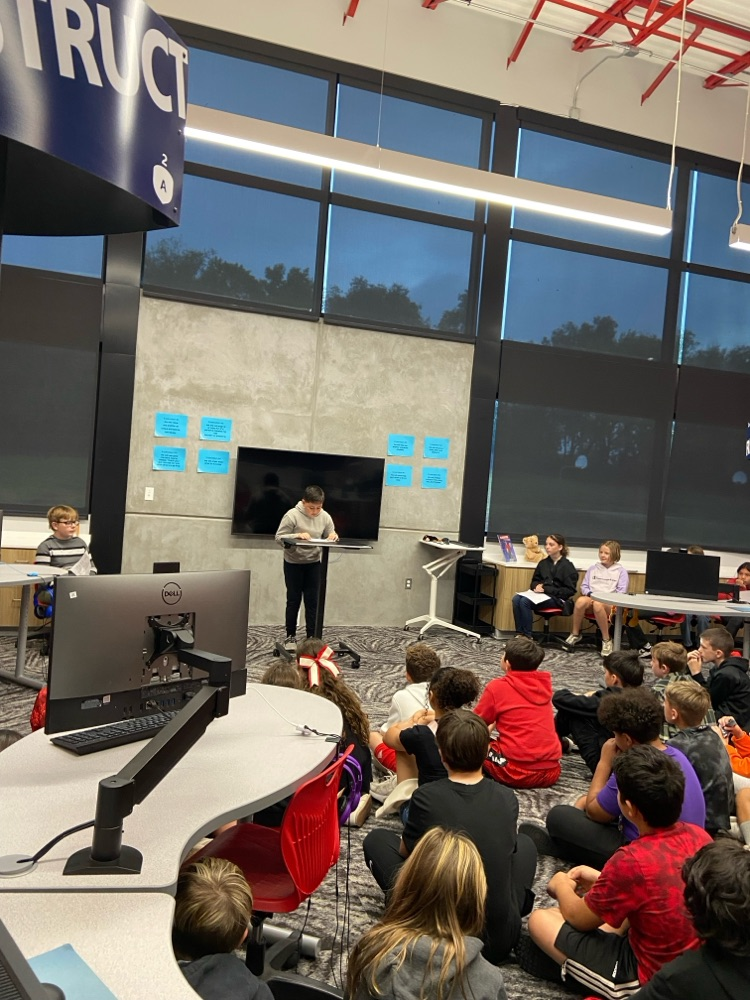 student giving speech to peers