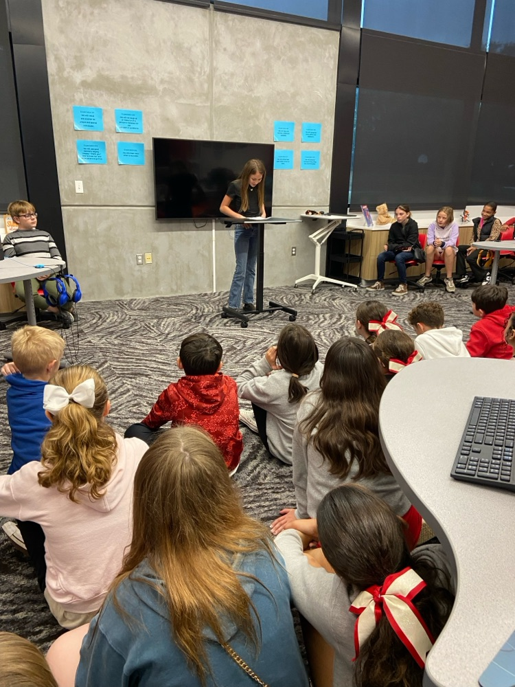 student giving speech to peers