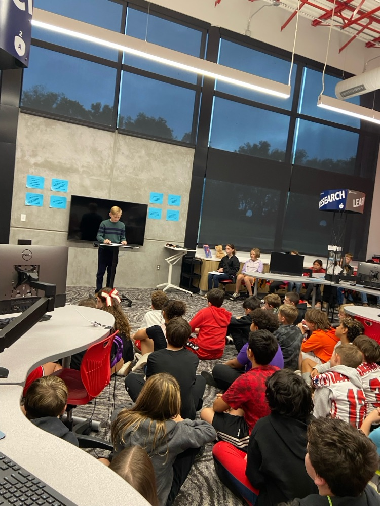 student giving speech to peers