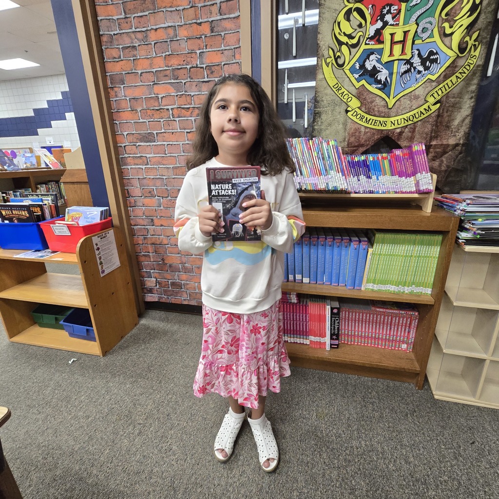 student holding book