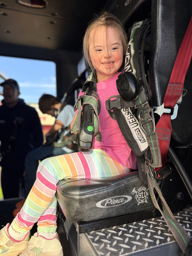 student in fire truck 