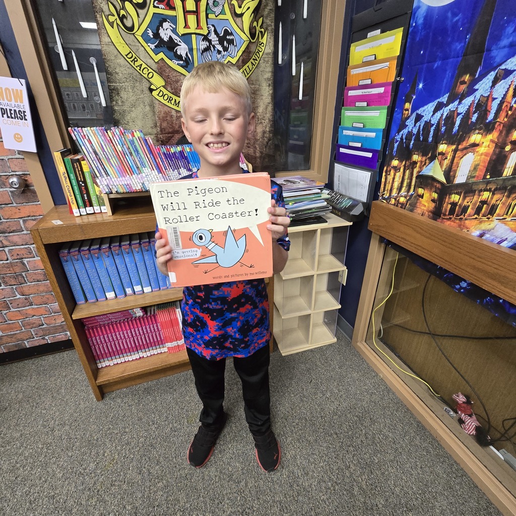 student holding book