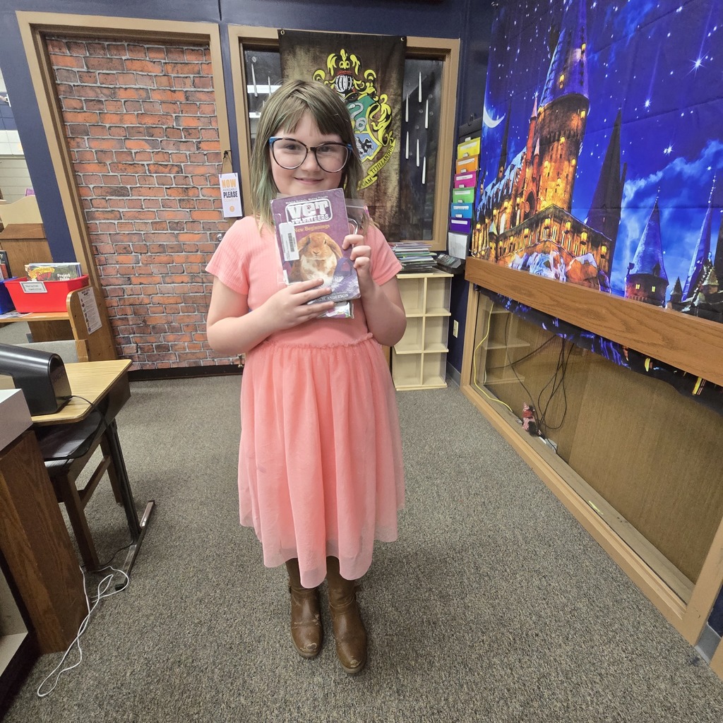 student holding book