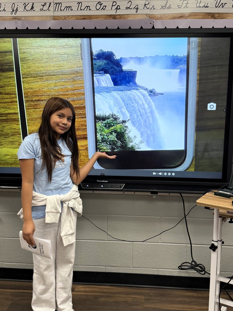 student showing photo of  Niagara Falls.