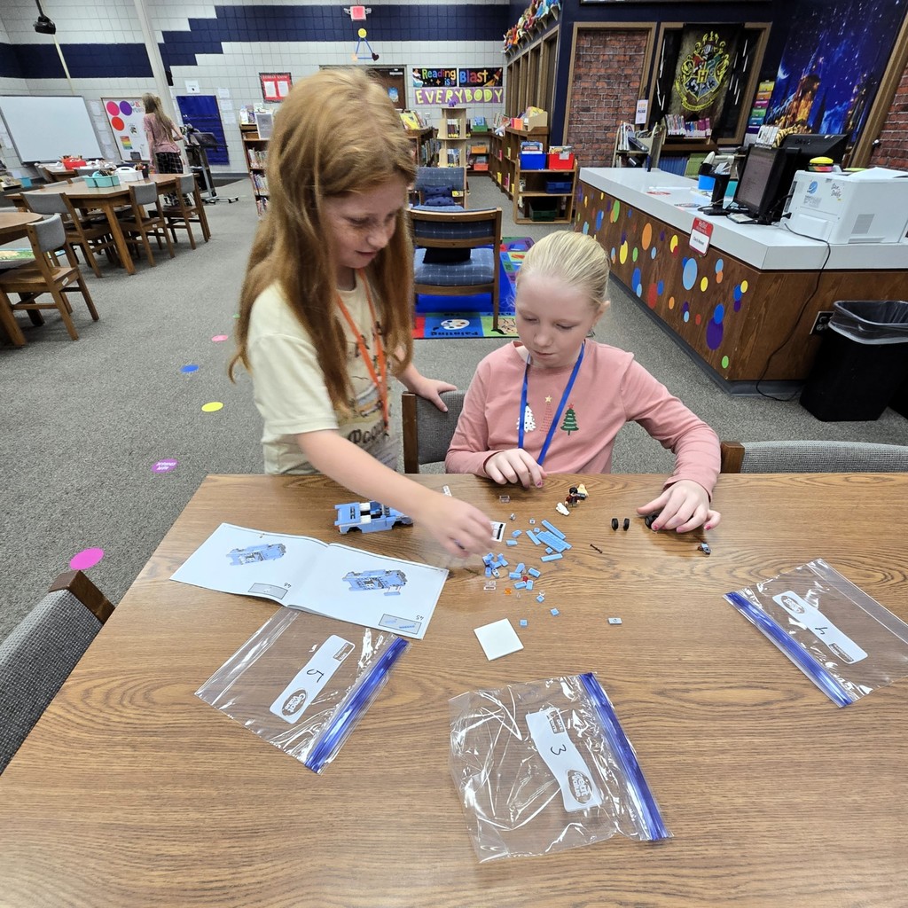 students building lego car