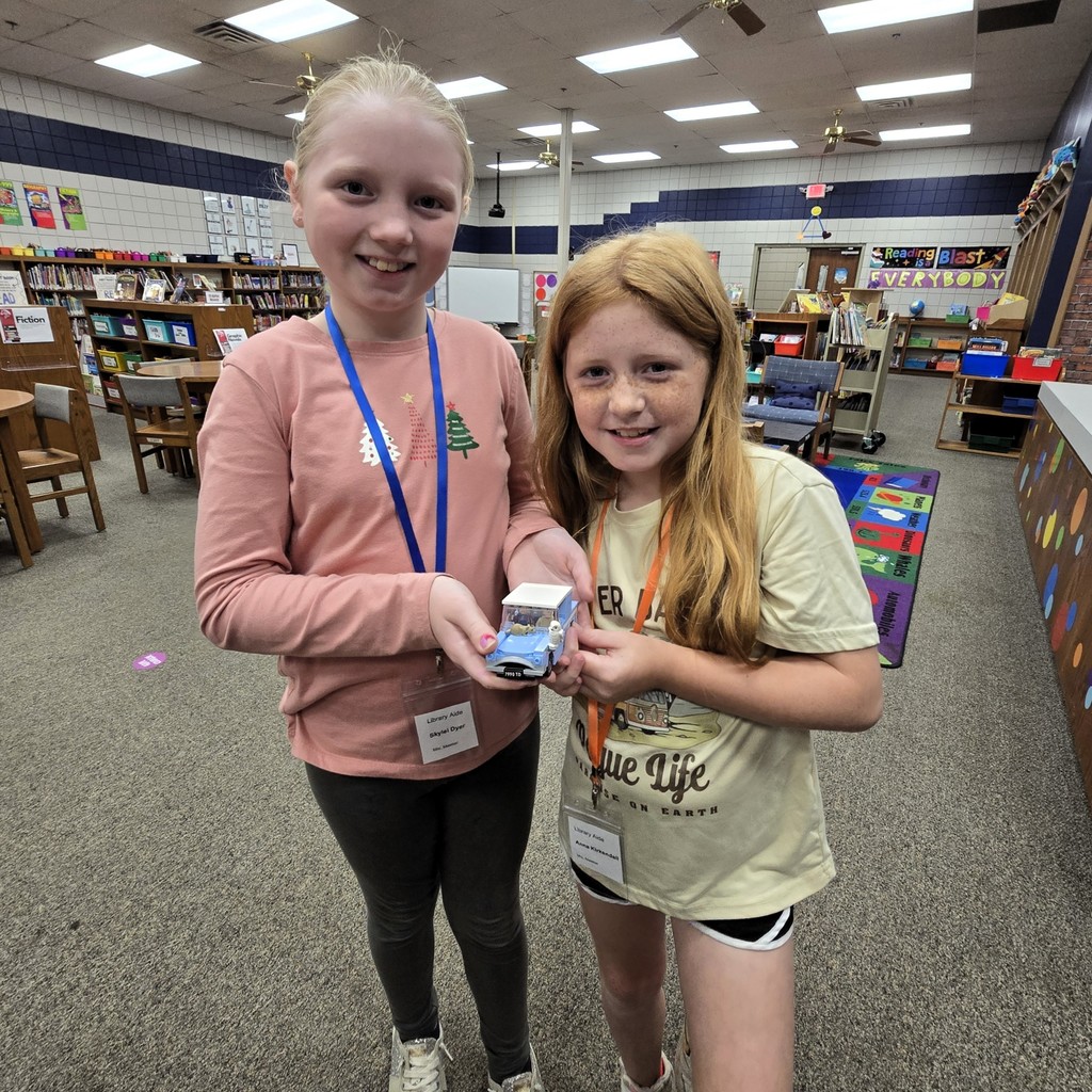 students holding harry potter car