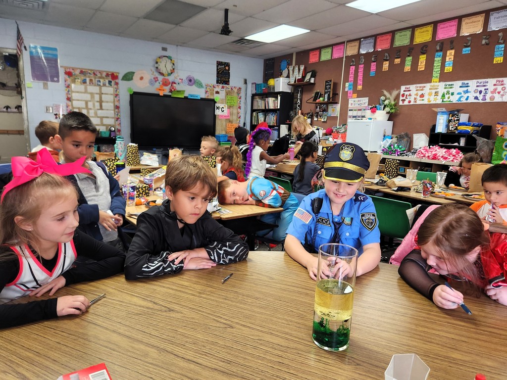 students participating with science project