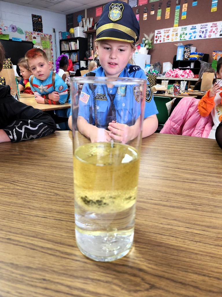 students looking at science project