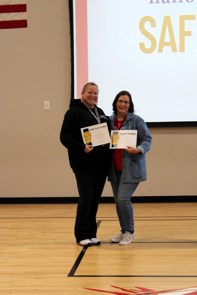 Mrs. Dudley and Ms. Massey holding awards