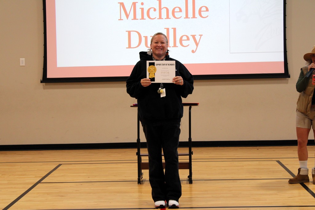 mrs. dudley holding award