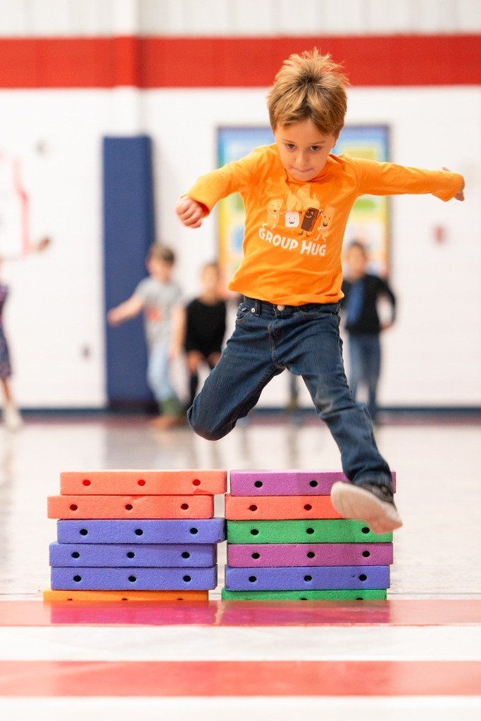students practicing hurdles