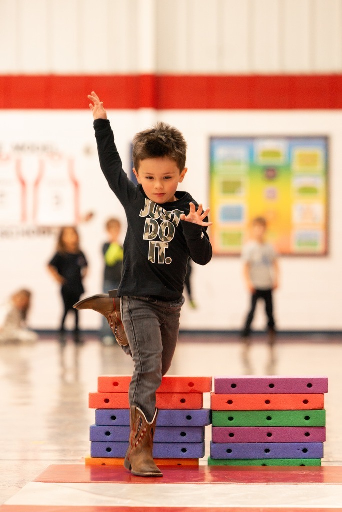 students practicing hurdles