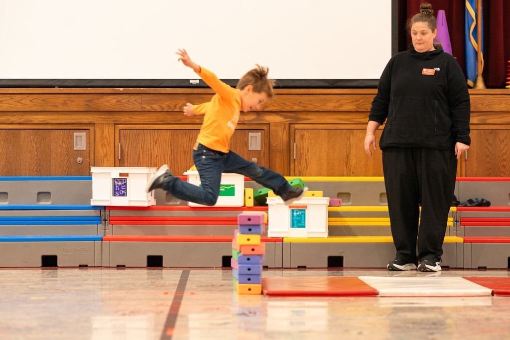 students practicing hurdles