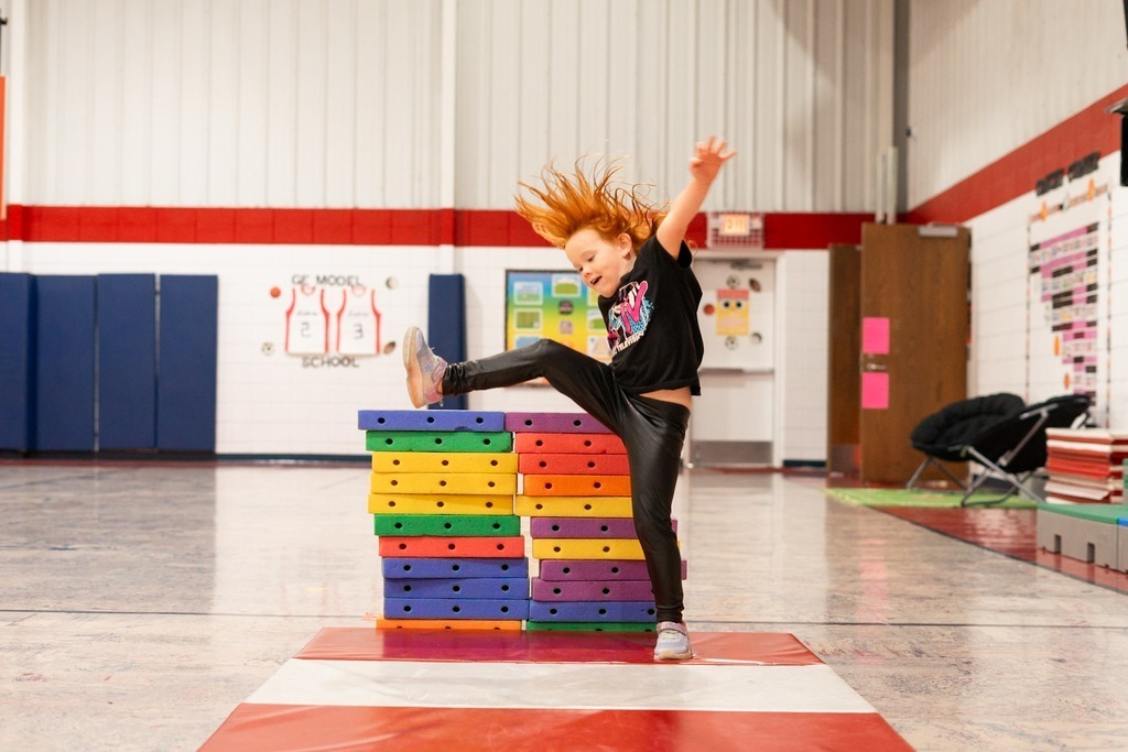 students practicing hurdles