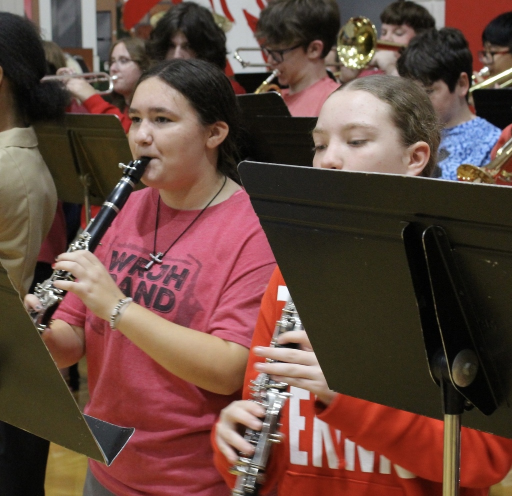 Students playing their instruments at a pep assembly