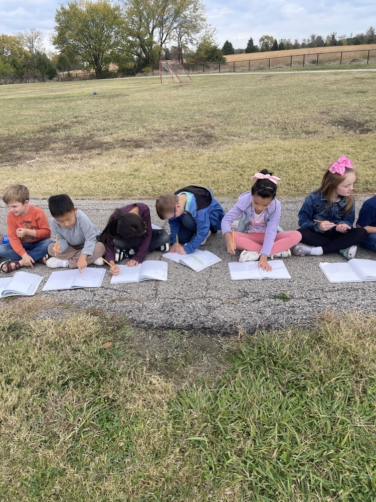 First grader's having class outside.