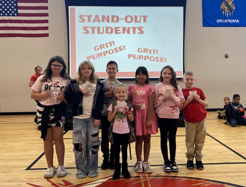 students holding grit paper