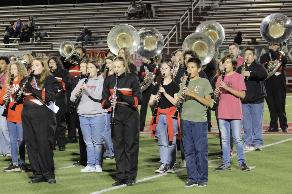 WRJH, Justus Tiawah and Claremore High school students on the field for a half time performance