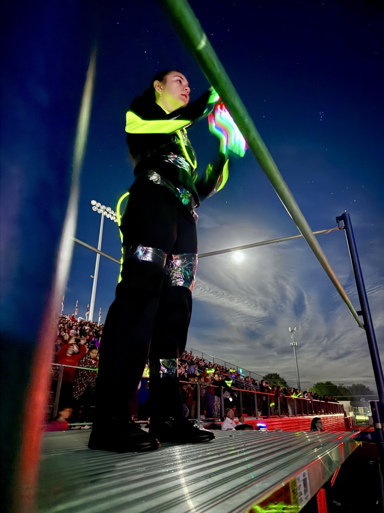Drum major leading the band during the glow show
