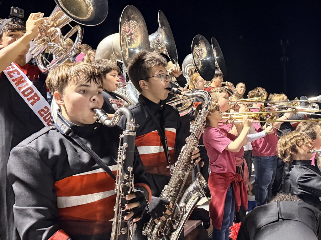 CHS Band and WRJH band in the stands at the Claremore football game