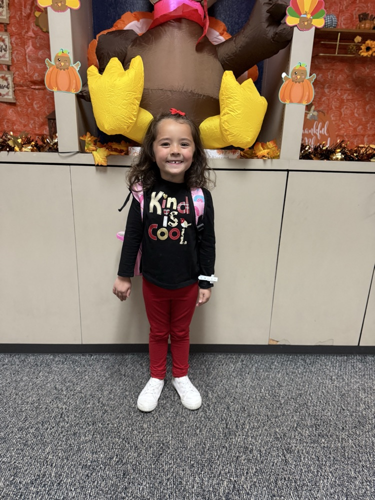 student with a kind shirt