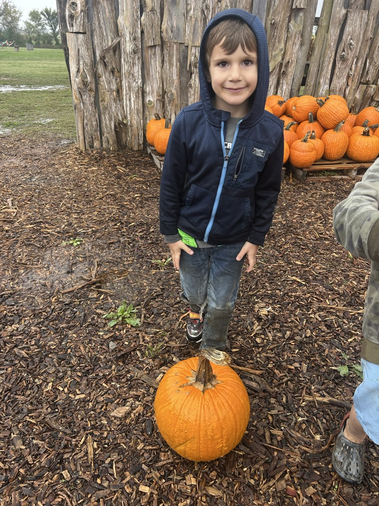 student with pumpkin