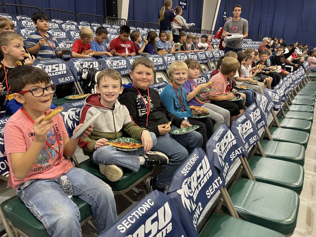 student smiling at RSU game