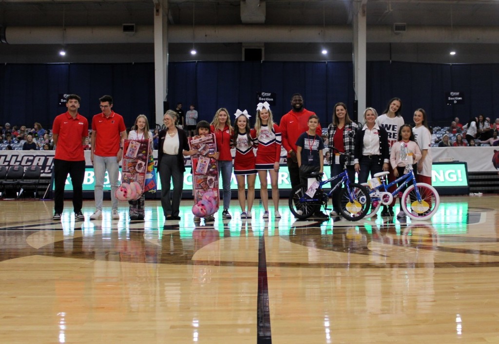 students smiling at RSU game