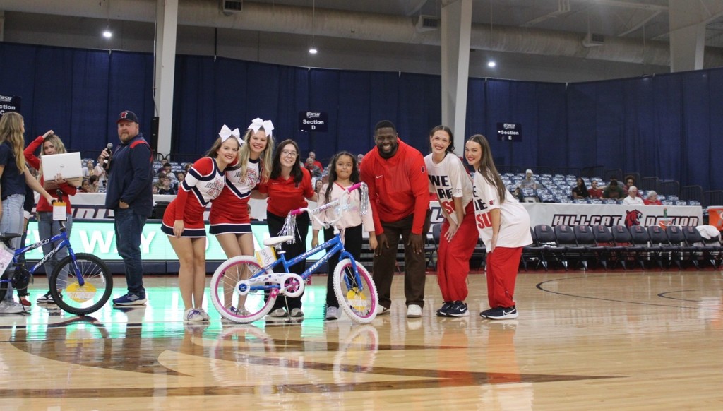 students smiling at RSU game