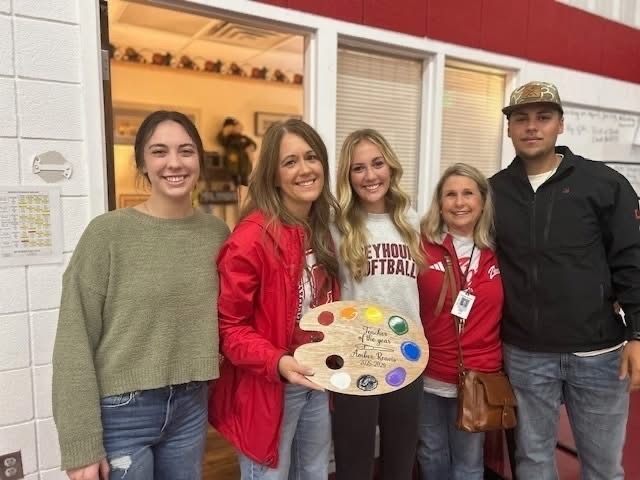 Mrs. Reavis with her family after receiving the teacher of the year award