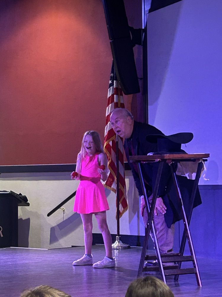 student doing magic tricks 