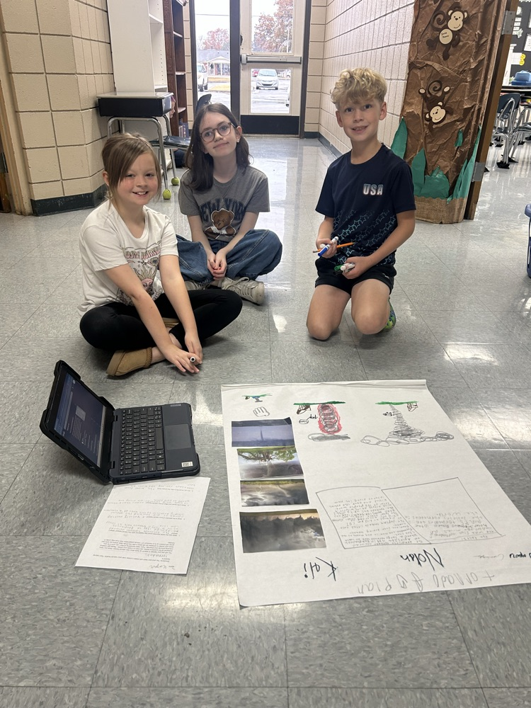 students working together on poster