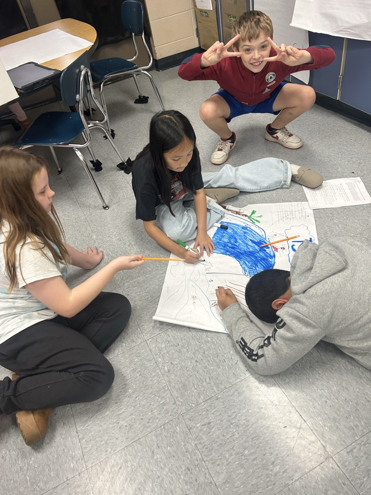students working together on poster