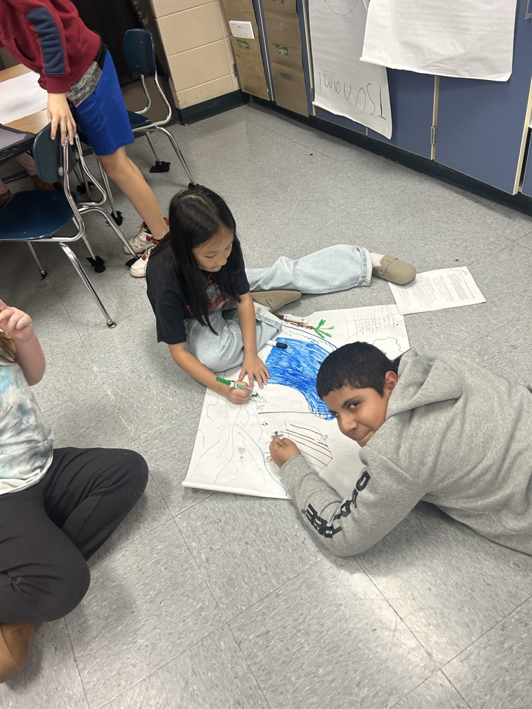 students working together on poster