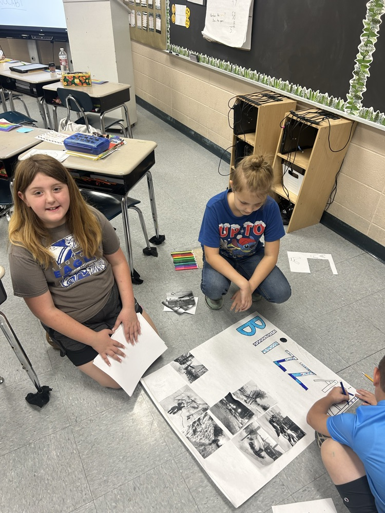 students working together on poster