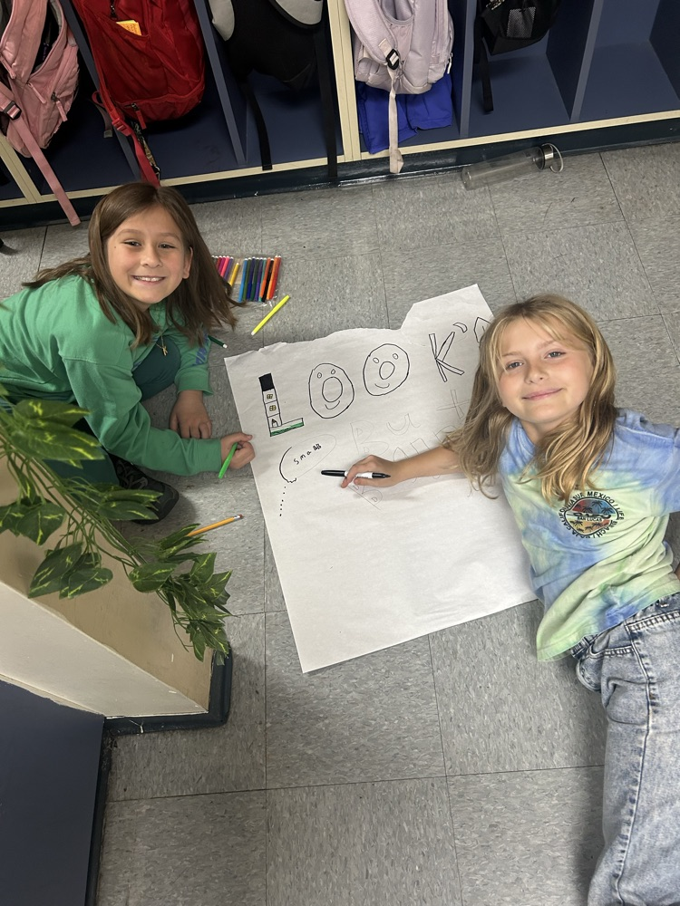 students working together on poster