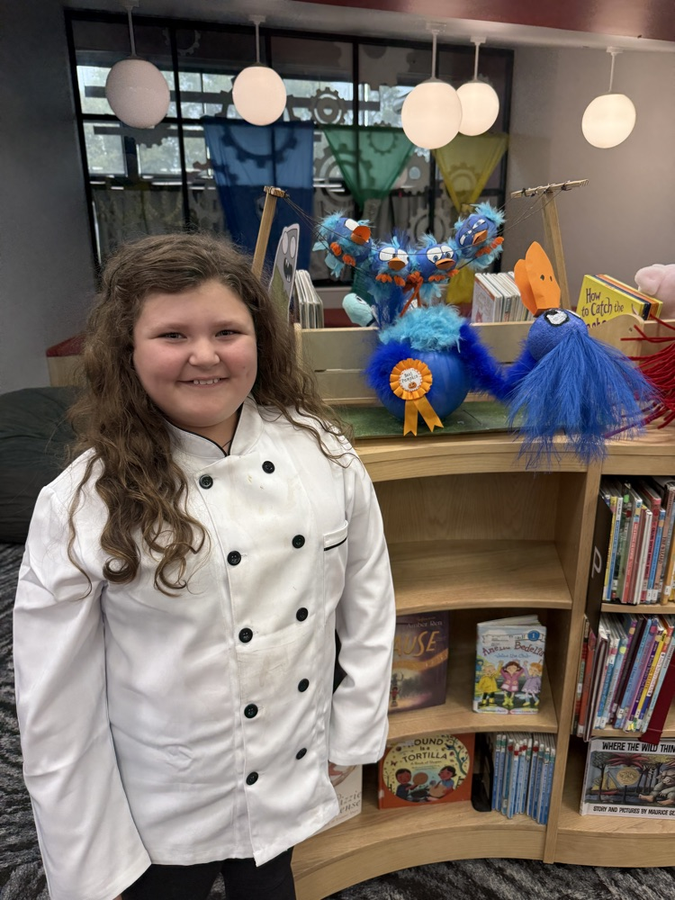 student with their pumpkin
