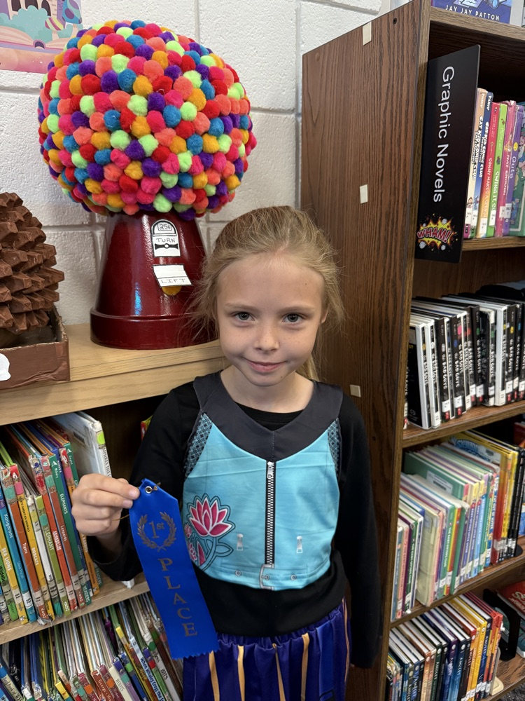 student with their pumpkin