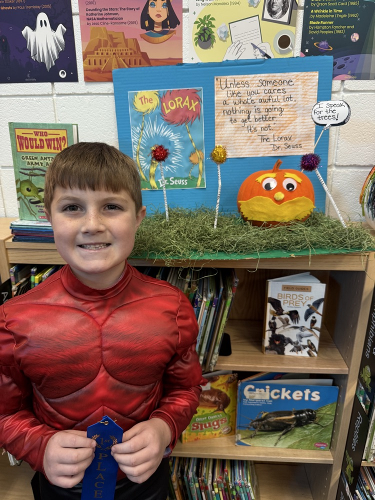 student with their pumpkin