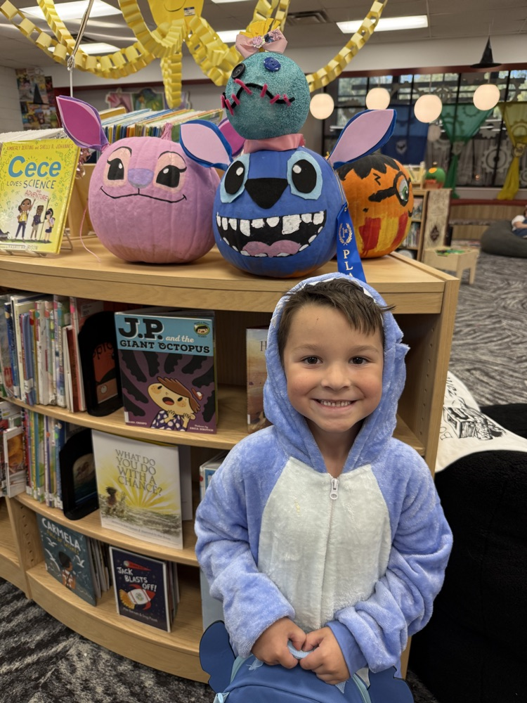 student with their pumpkin