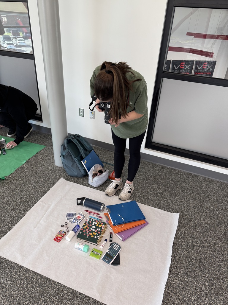 In photography, students created flat lays to tell the story of their life at school using only the contents of their backpacks. They used principles of balance and symmetry to arrange their items and captured their shots using natural window light.  Such a creative way to blend personal storytelling with technical skills!