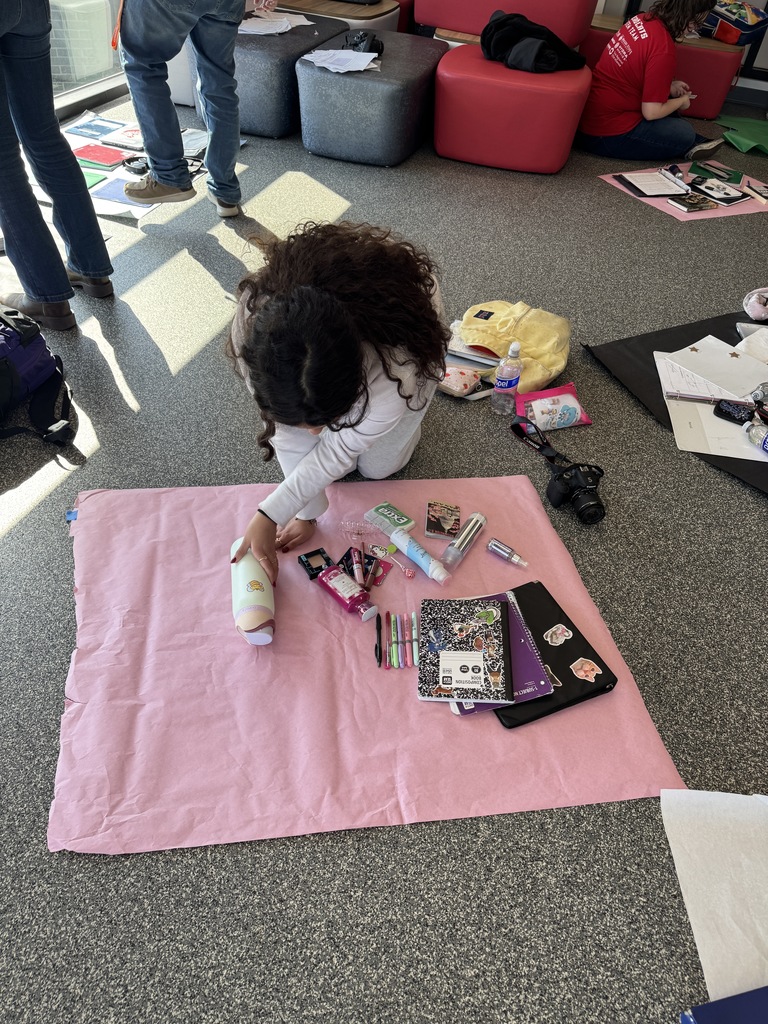 In photography, students created flat lays to tell the story of their life at school using only the contents of their backpacks. They used principles of balance and symmetry to arrange their items and captured their shots using natural window light.  Such a creative way to blend personal storytelling with technical skills!
