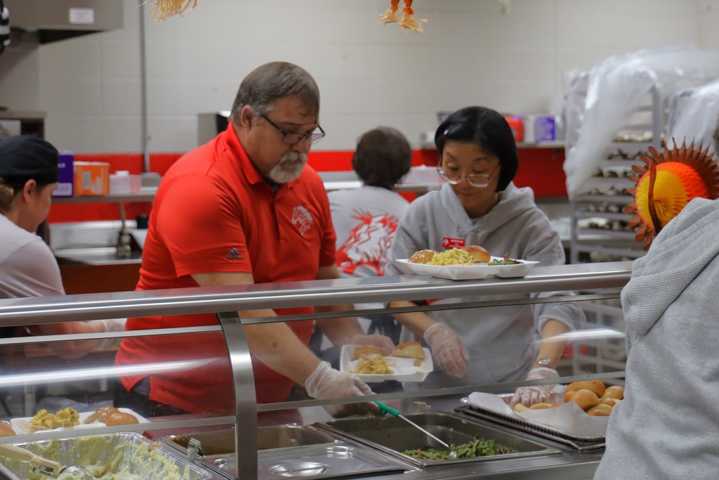staff serving thanksgiving meal