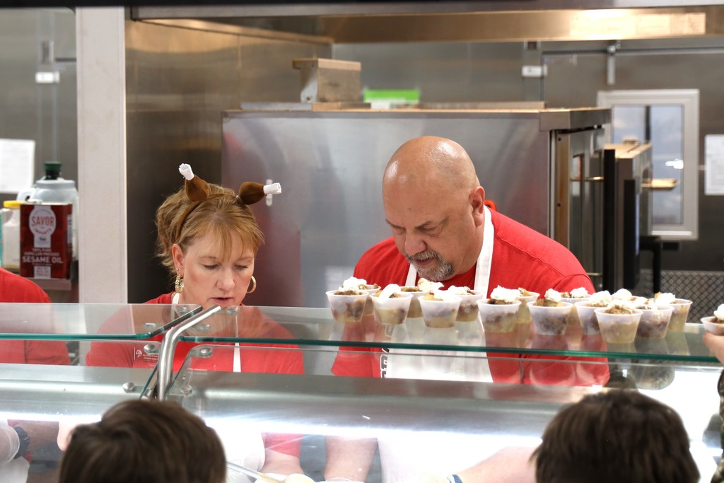 staff serving thanksgiving meal