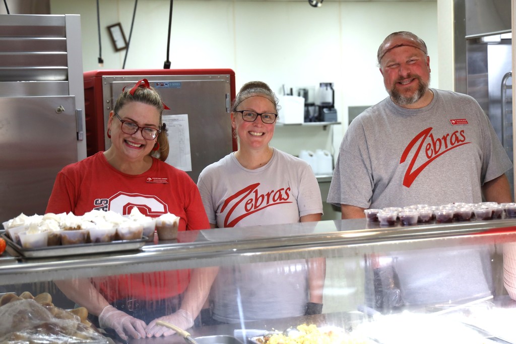 staff serving thanksgiving meal