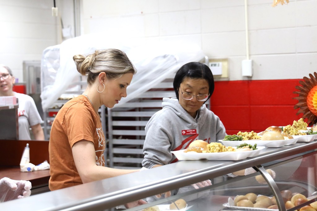 staff serving thanksgiving meal